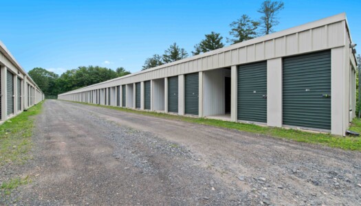 aisle of drive-up storage units at Pioneer Valley Storage in Belchertown, MA