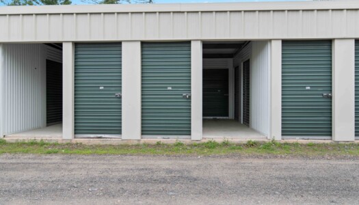row of drive-up storage units at a fenced Pioneer Valley Storage facility in Belchertown, MA